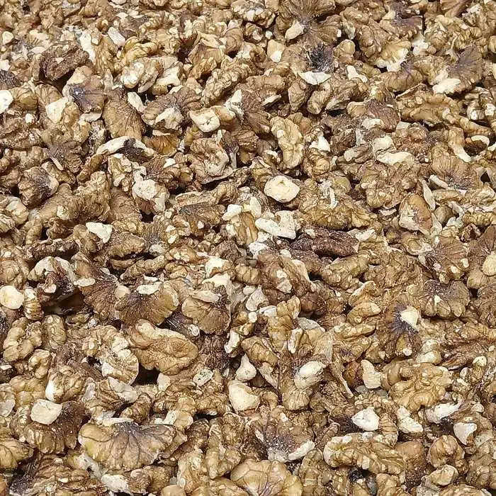 A heap of freshly shelled walnut kernels
